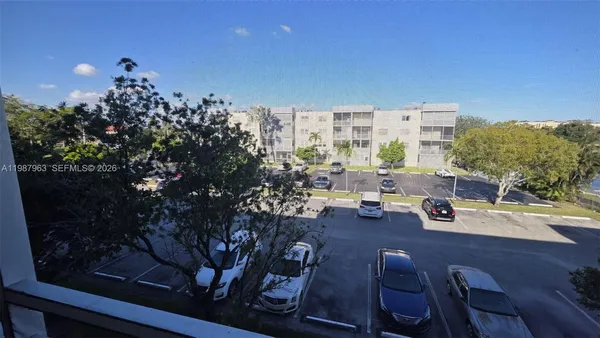 a view of a glass door and a yard