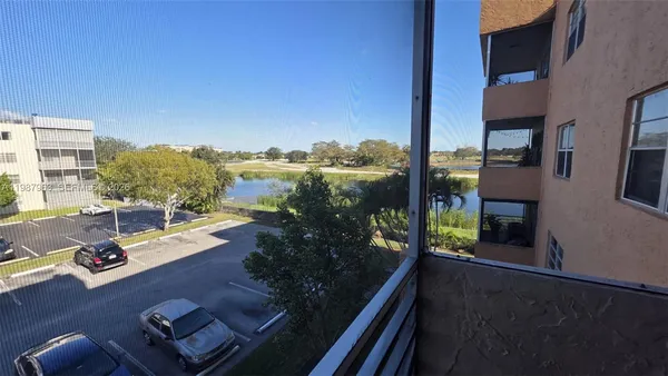 a view of a livingroom with furniture and natural light