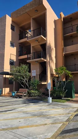 a view of balcony with wooden floor