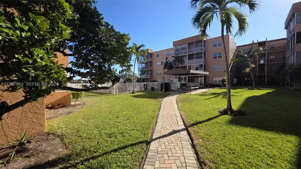 a view of a patio with a table and chairs