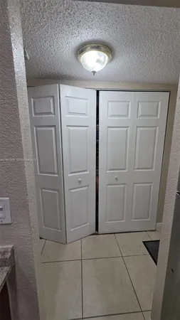 a bathroom with a vanity and mirror