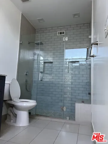 a view of hallway with stairs and a window