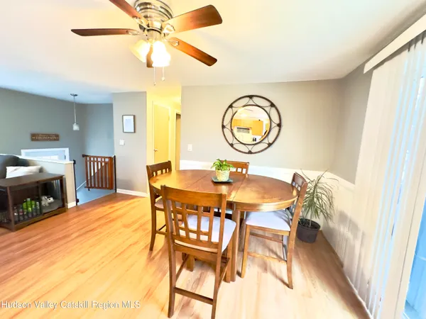 a dining room with furniture and a fireplace