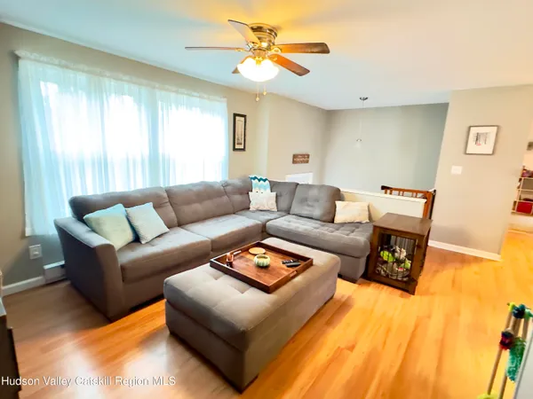 a living room with furniture and a window