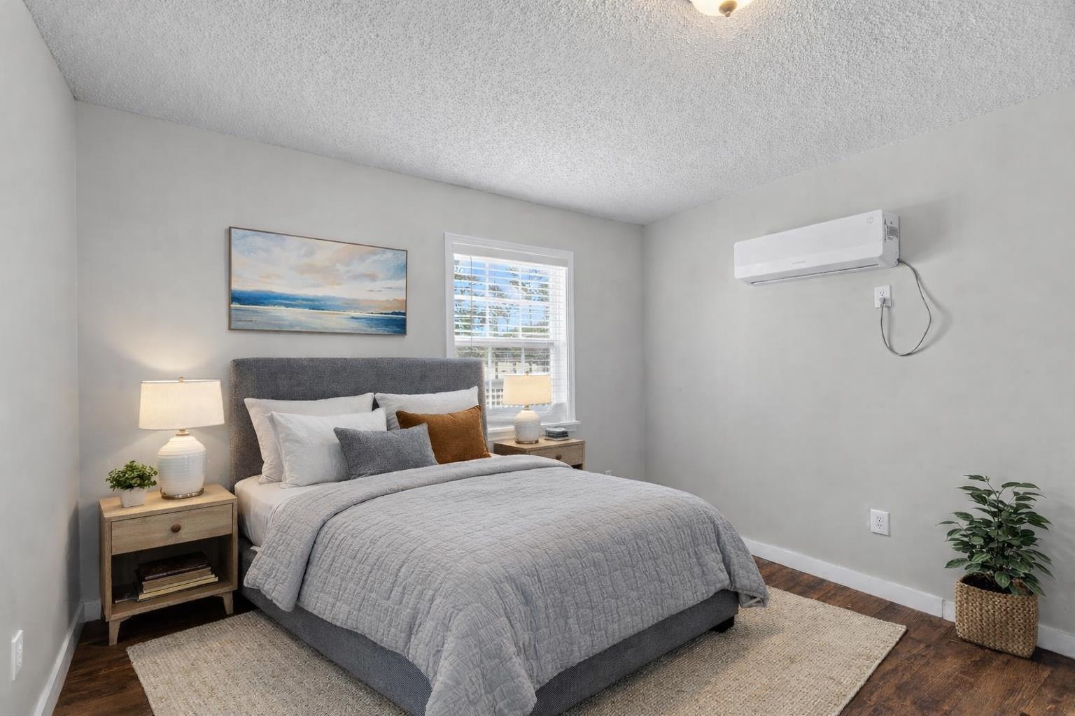 2030 South Main Street Covington, TN 38019 - Photo 13 of 27 a bedroom with a bed and a potted plant