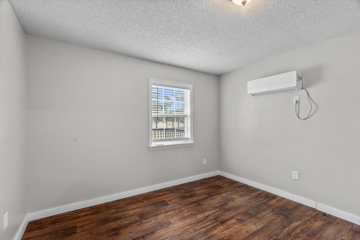 2030 South Main Street Covington, TN 38019 - Photo 14 of 27 a view of a room with wooden floor and windows
