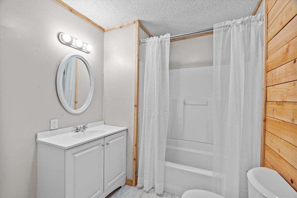 2030 South Main Street Covington, TN 38019 - Photo 16 of 27 a bathroom with a sink a toilet and a mirror