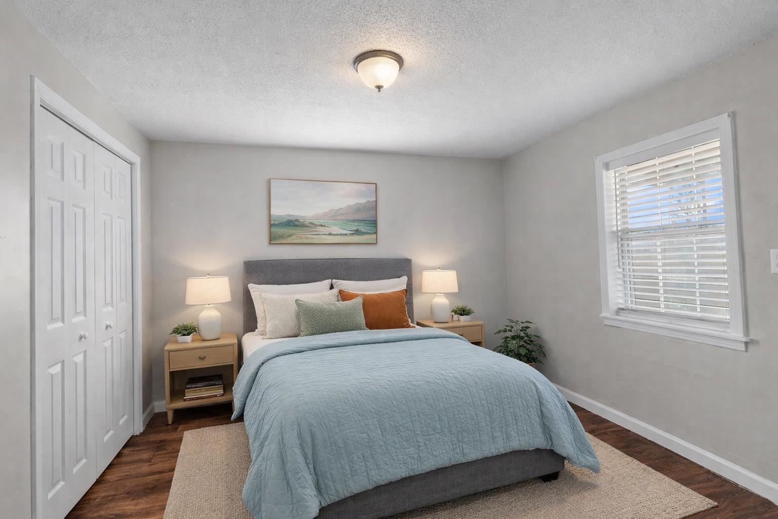 2030 South Main Street Covington, TN 38019 - Photo 17 of 27 a bedroom with a bed and a painting on the wall