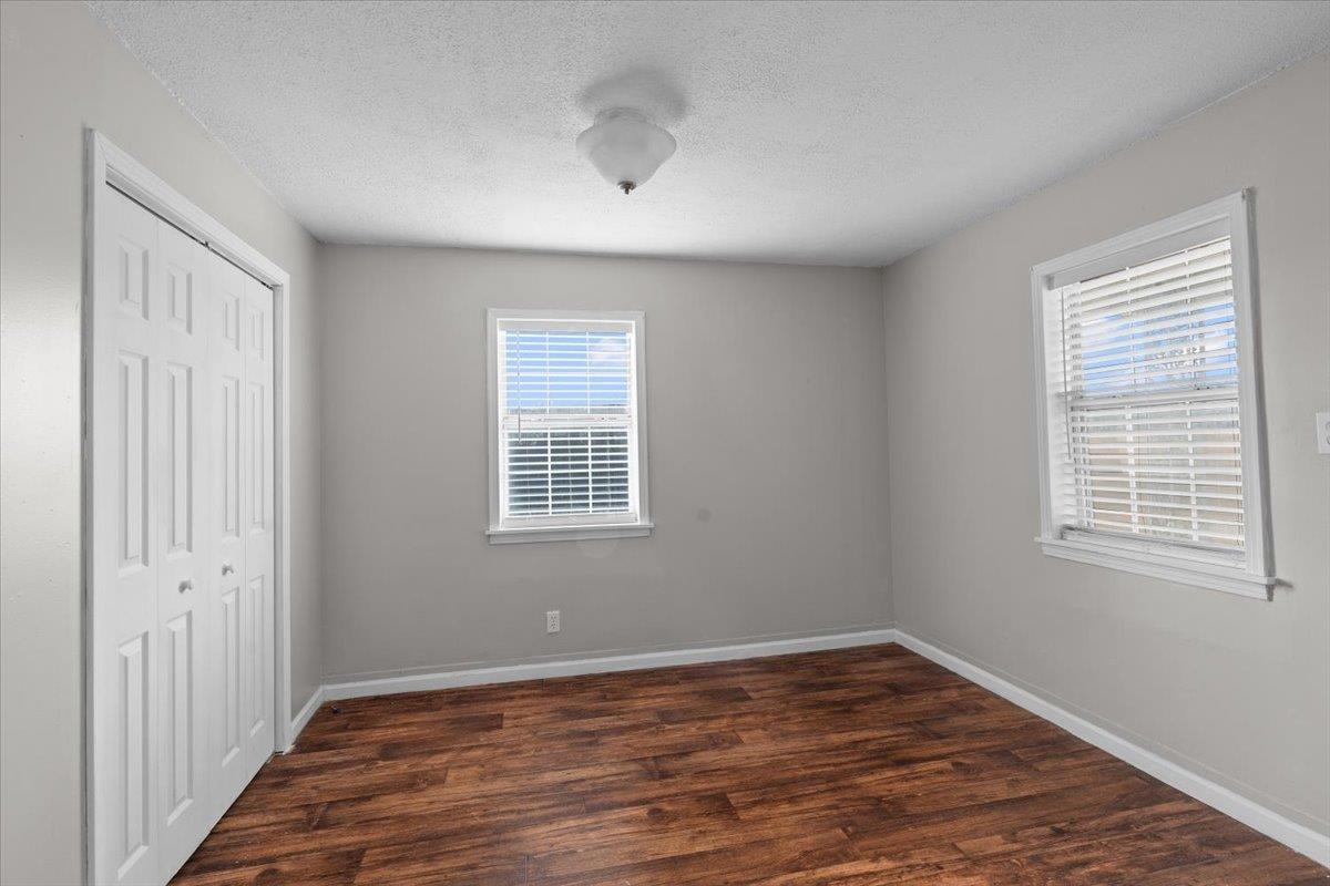 2030 South Main Street Covington, TN 38019 - Photo 18 of 27 a view of an empty room with wooden floor and a window