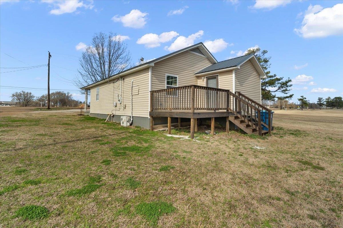 2030 South Main Street Covington, TN 38019 - Photo 21 of 27 a front view of a house with a yard