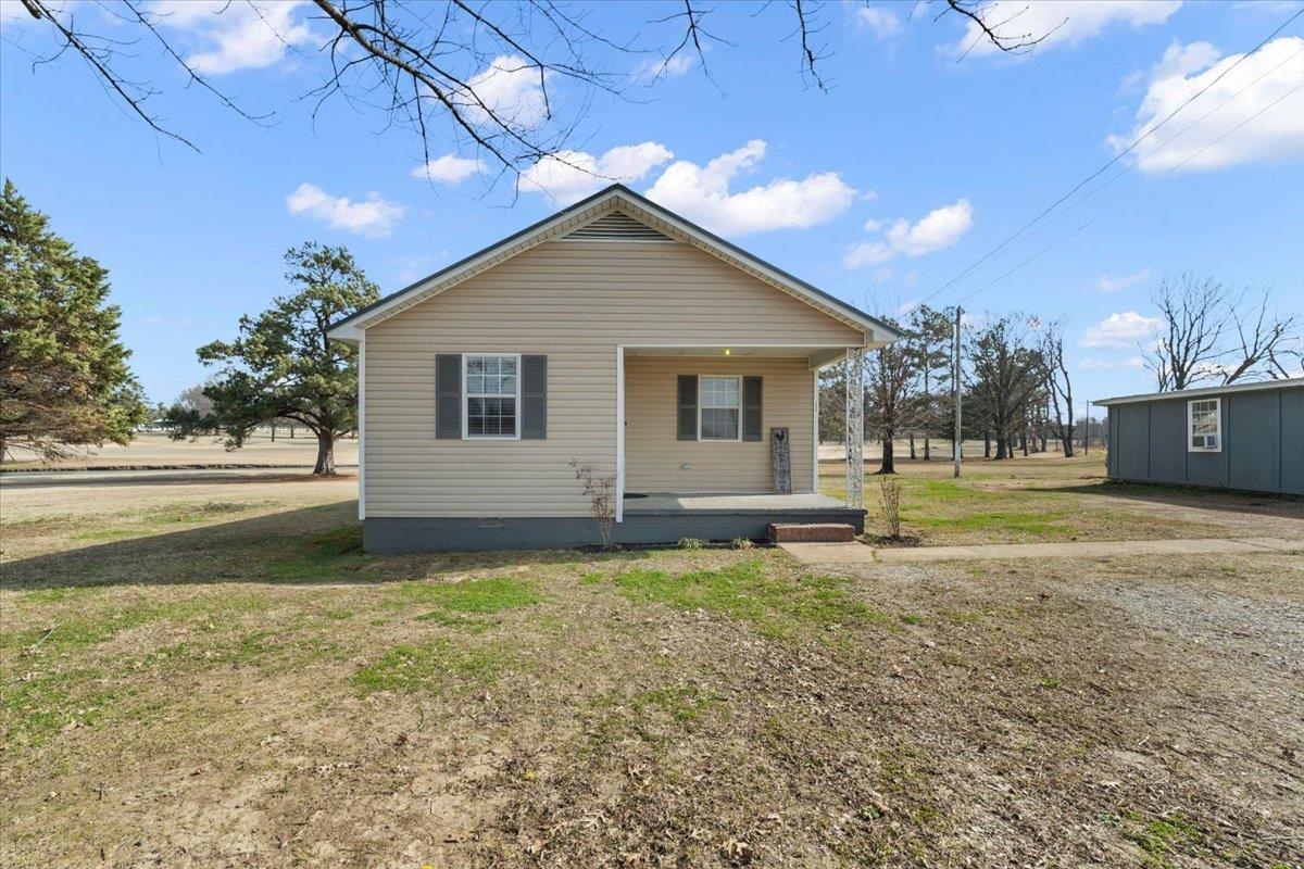 2030 South Main Street Covington, TN 38019 - Photo 22 of 27 a view of a house with a yard