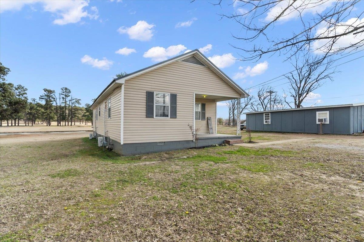 2030 South Main Street Covington, TN 38019 - Photo 23 of 27 a view of a house with a yard