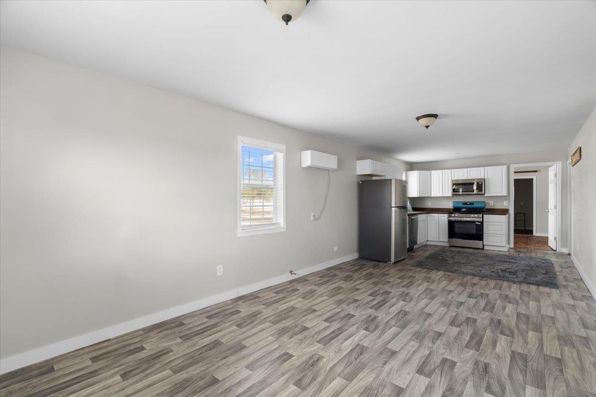 2030 South Main Street Covington, TN 38019 - Photo 5 of 27 a view of a kitchen with a sink and a refrigerator