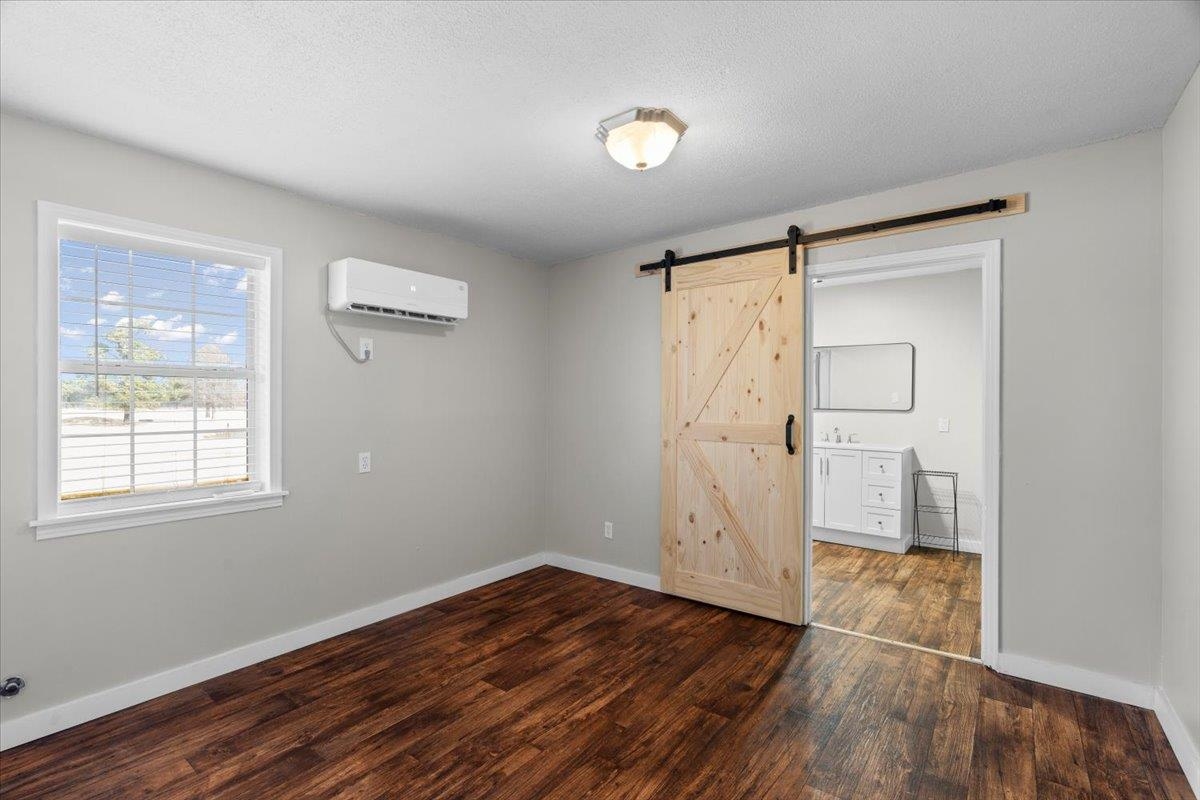 2030 South Main Street Covington, TN 38019 - Photo 10 of 27 an empty room with wooden floor and a window