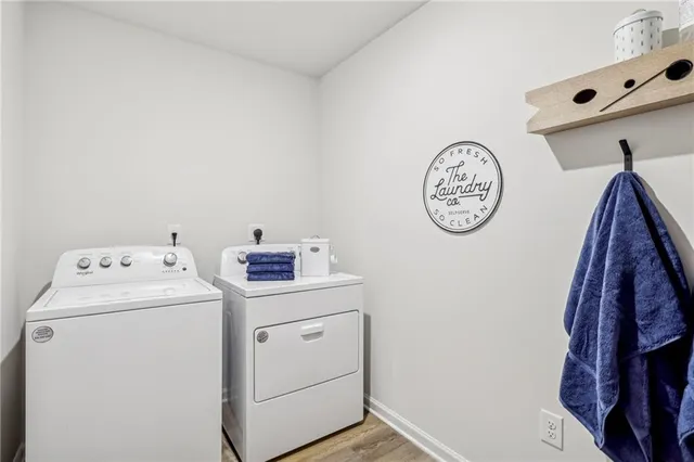 a view of a storage & utility room with dryer and washer