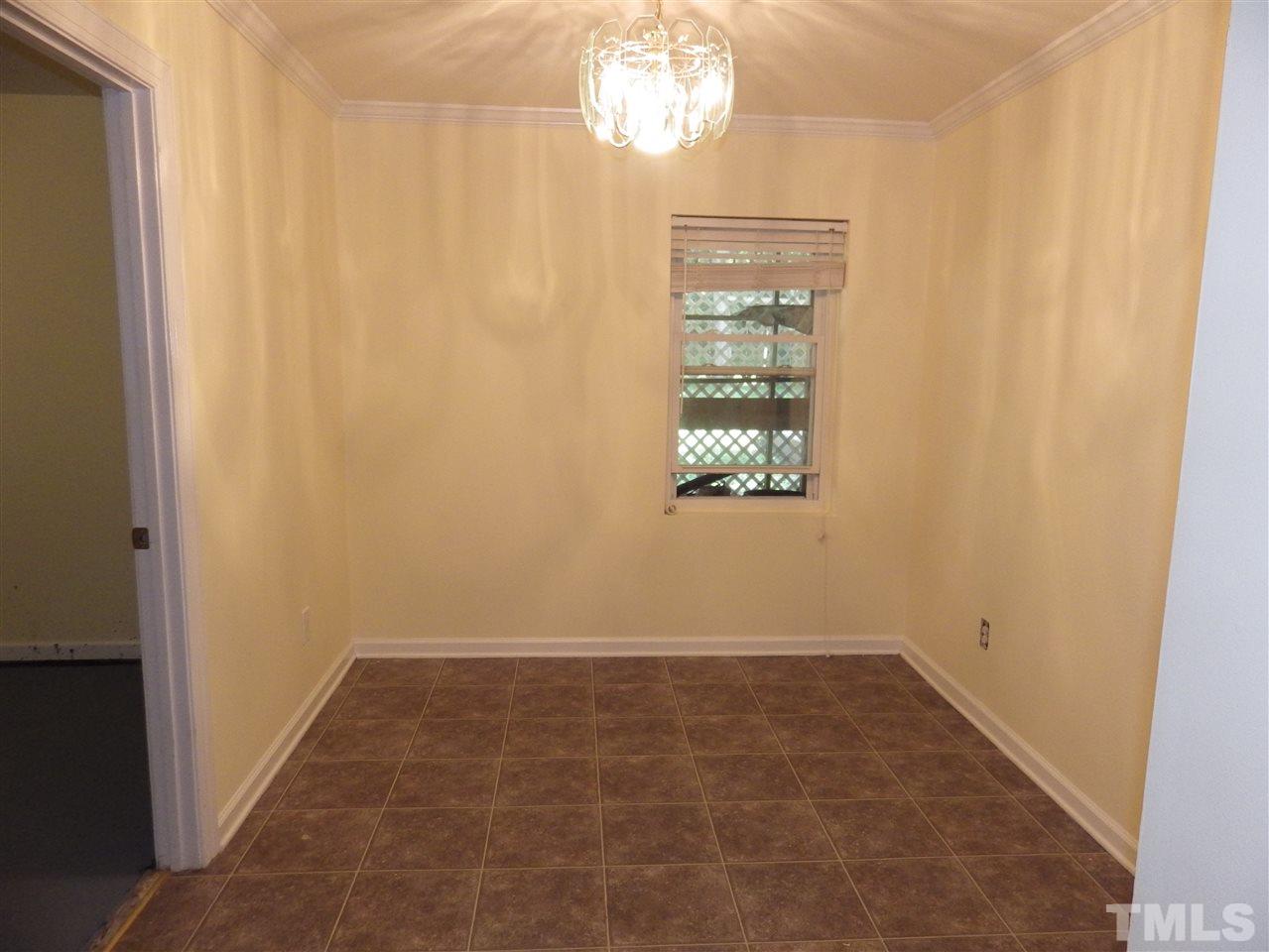 11212 Sedgefield Drive Raleigh, NC 27613 - Photo 11 of 16 Basement dining room