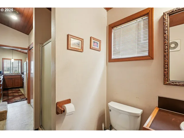 a bed room with a bed and a chair