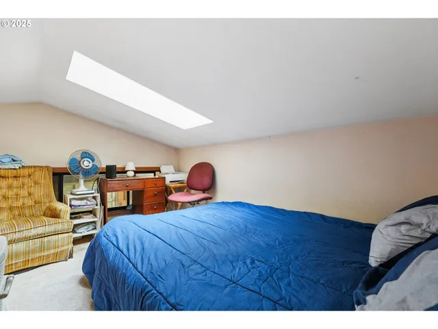 a bedroom with furniture and a wooden floor
