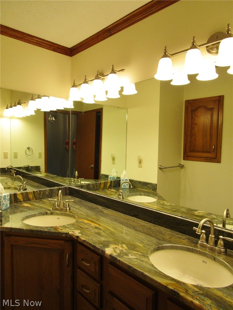 4024 Stoney Ridge Road Avon, OH 44011 - Photo 23 of 35 Remodeled main bath with granite counter-tops and double sinks
