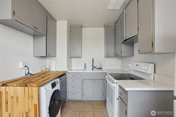 a utility room with sink a washer and dryer