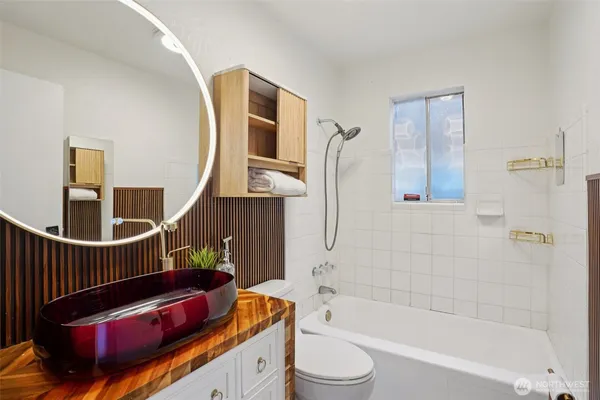 a bathroom with a bathtub sink and toilet