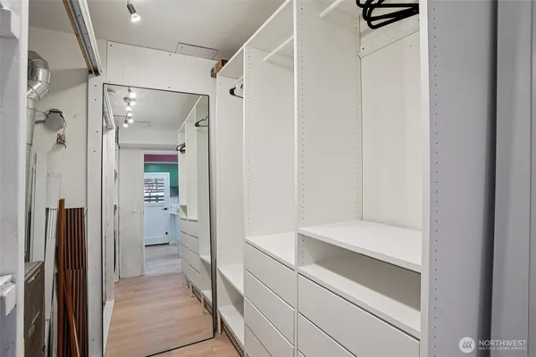 a bathroom with a shower and a sink