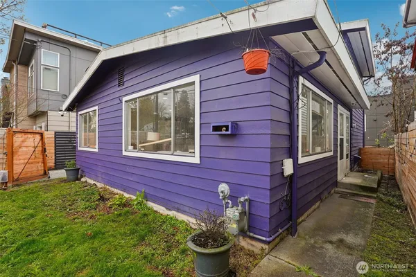 a view of a backyard with a wooden fence