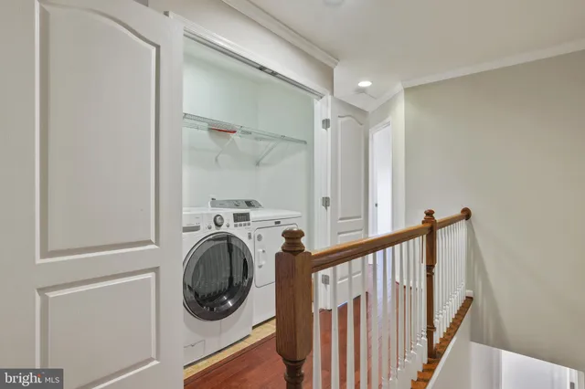 a view of a hallway with washer and dryer