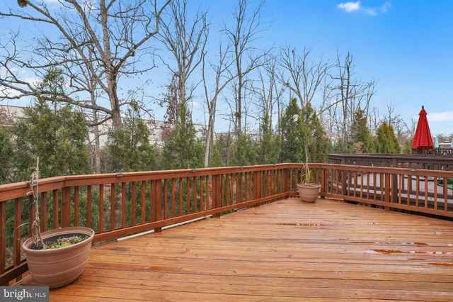 a view of a balcony with wooden fence