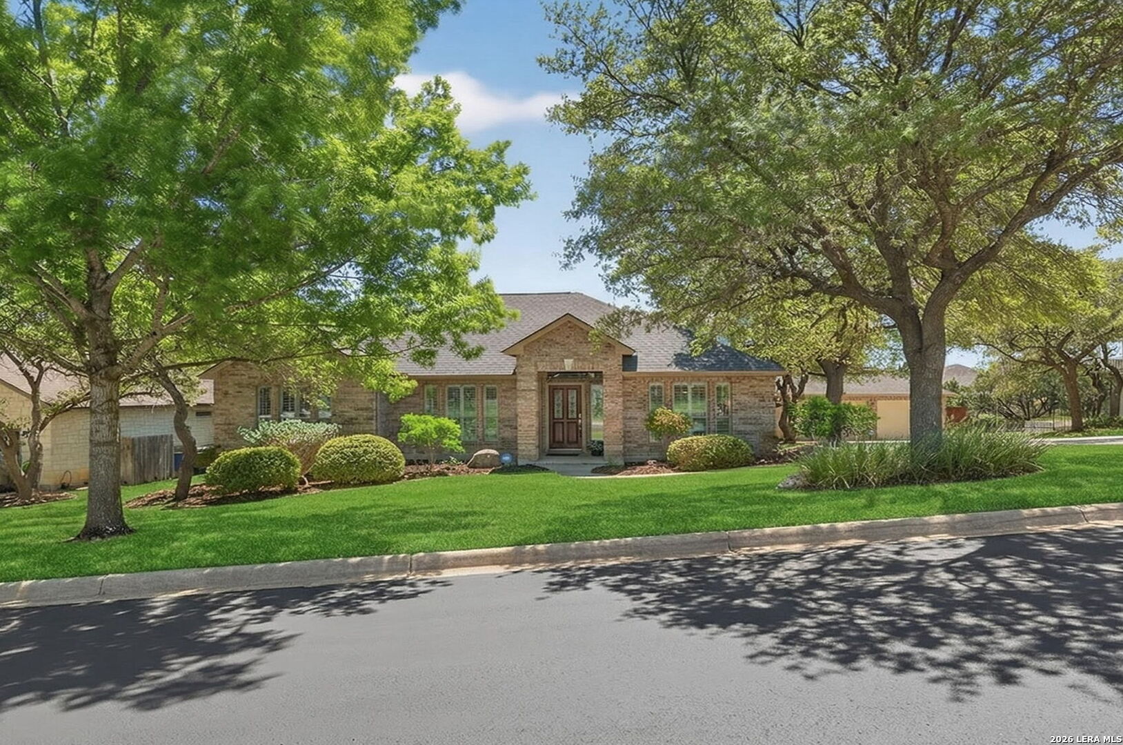 9514 Potters Point Helotes, TX 78023 - Photo 1 of 37 a front view of a house with a garden