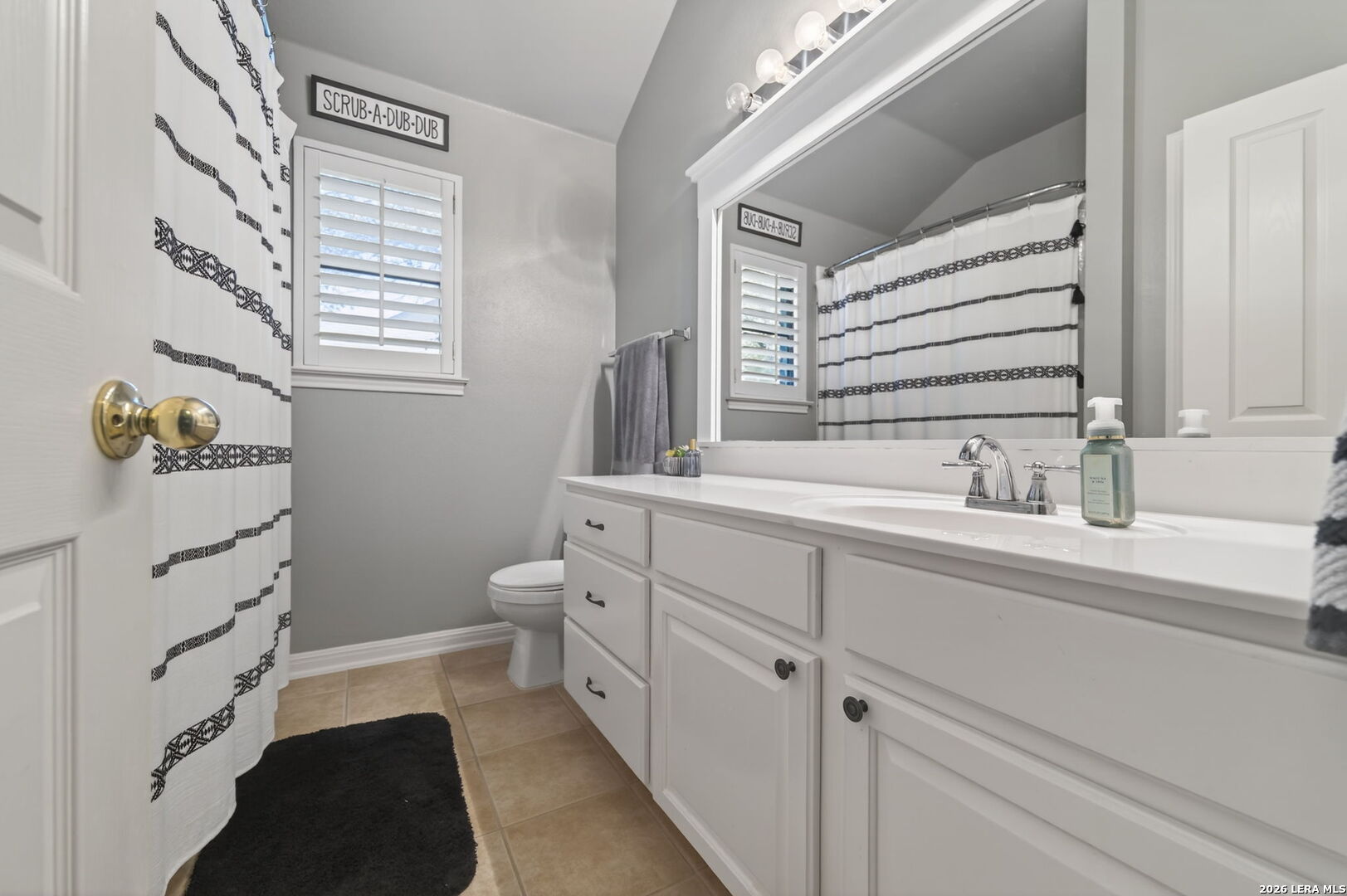 9514 Potters Point Helotes, TX 78023 - Photo 15 of 37 a bathroom with a sink a toilet and bathtub