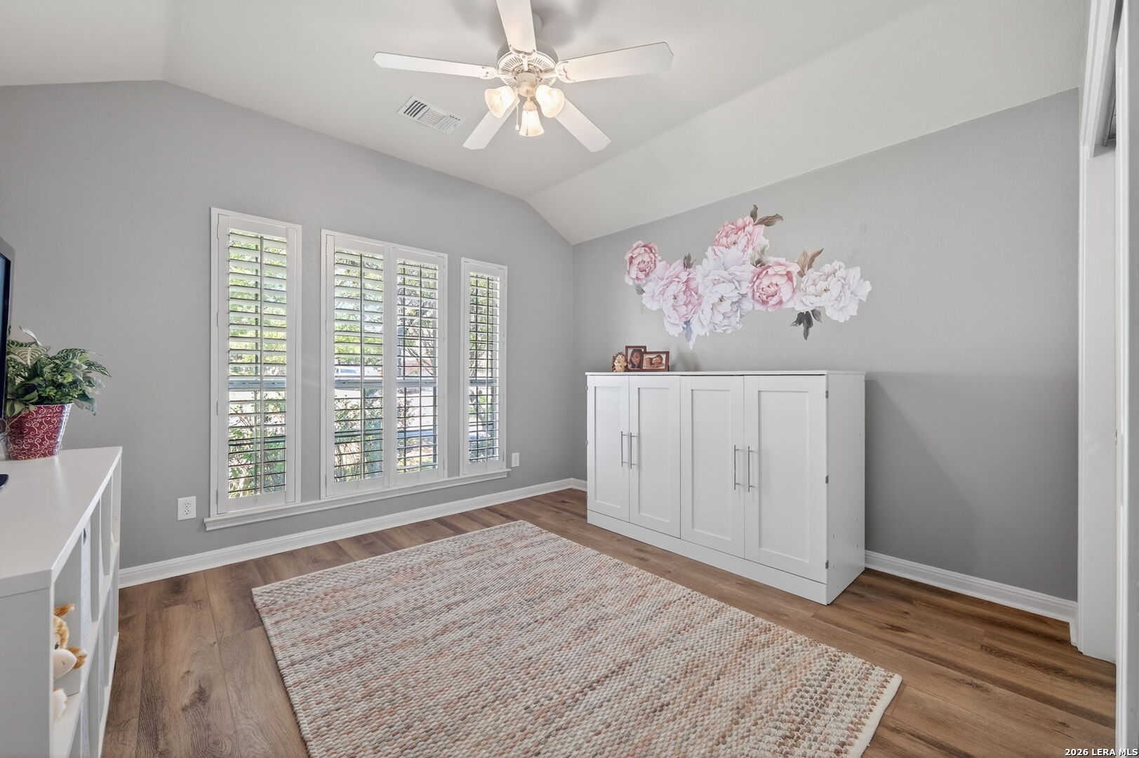 9514 Potters Point Helotes, TX 78023 - Photo 16 of 37 a view of an empty room with a window and wooden floor