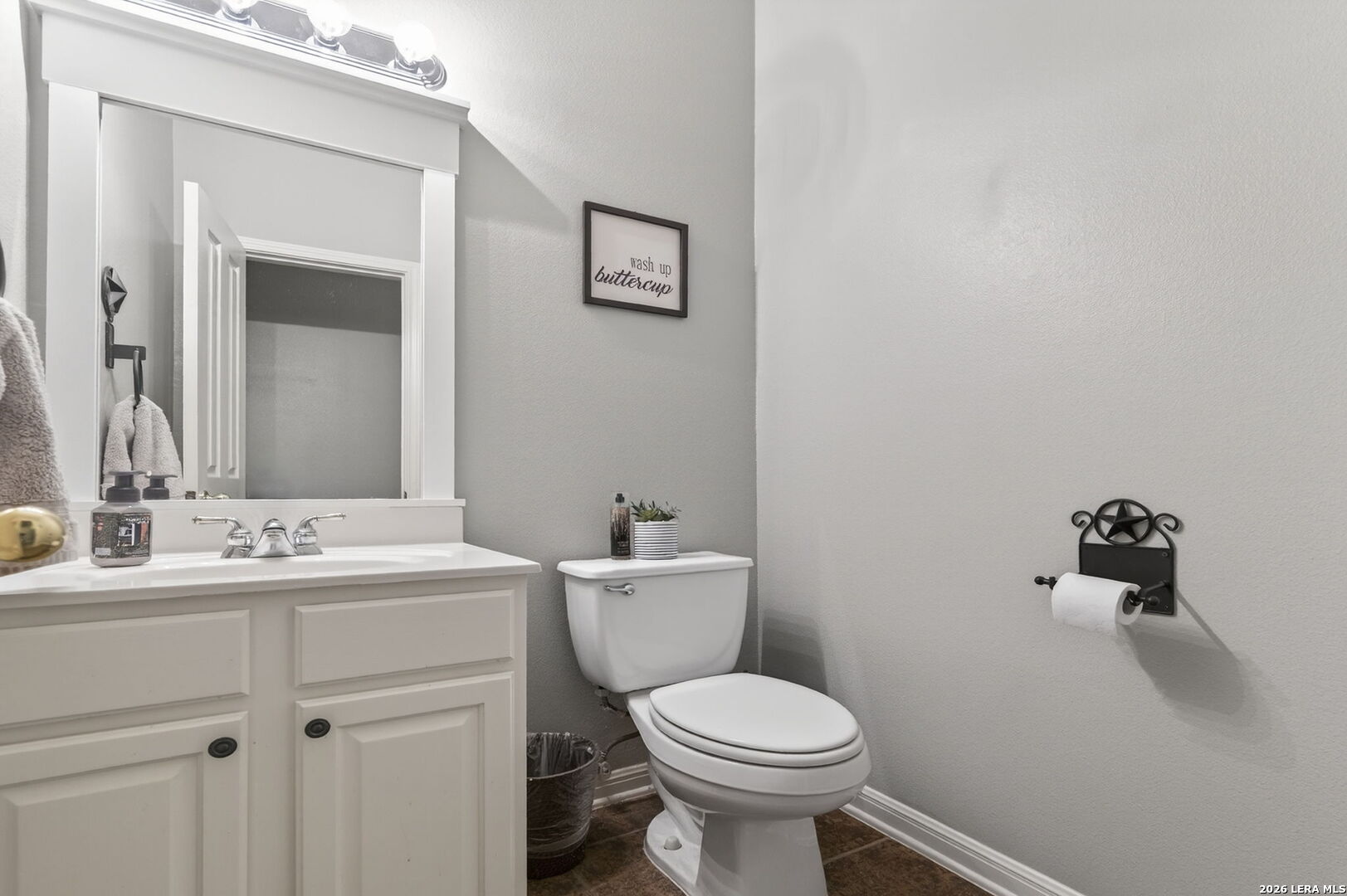 9514 Potters Point Helotes, TX 78023 - Photo 17 of 37 a bathroom with a sink mirror and toilet