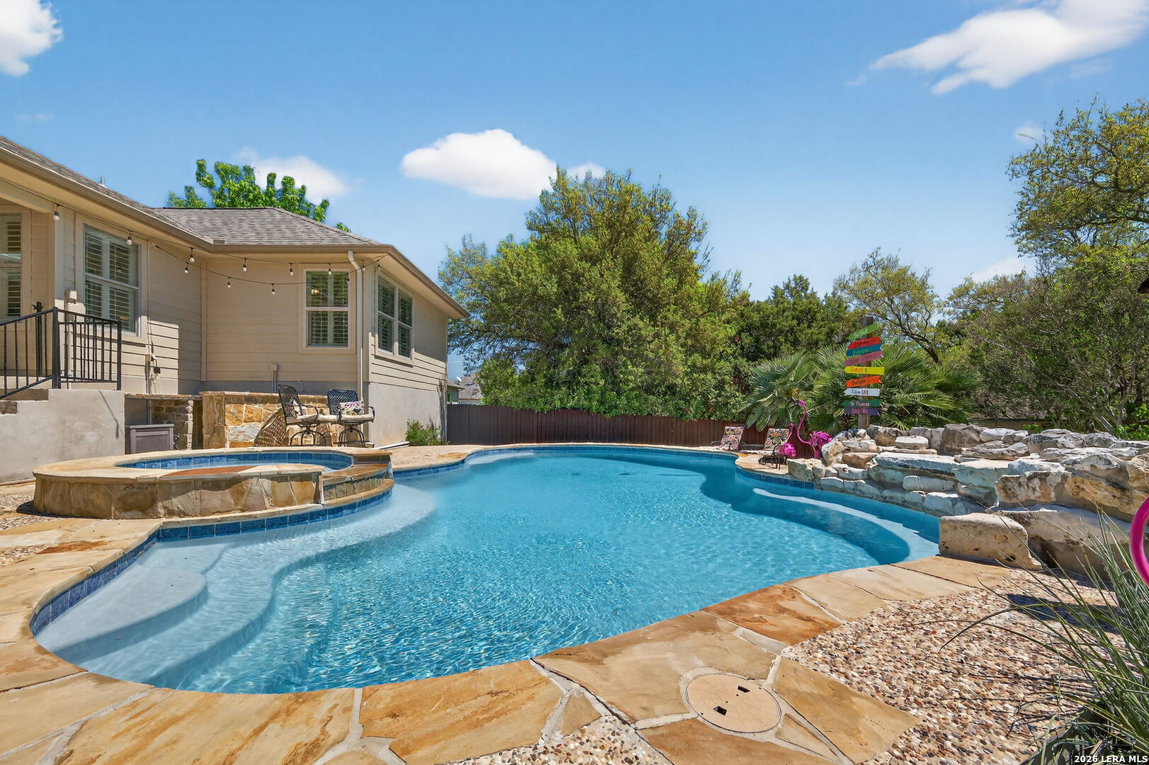 9514 Potters Point Helotes, TX 78023 - Photo 2 of 37 a view of a house with swimming pool and sitting area