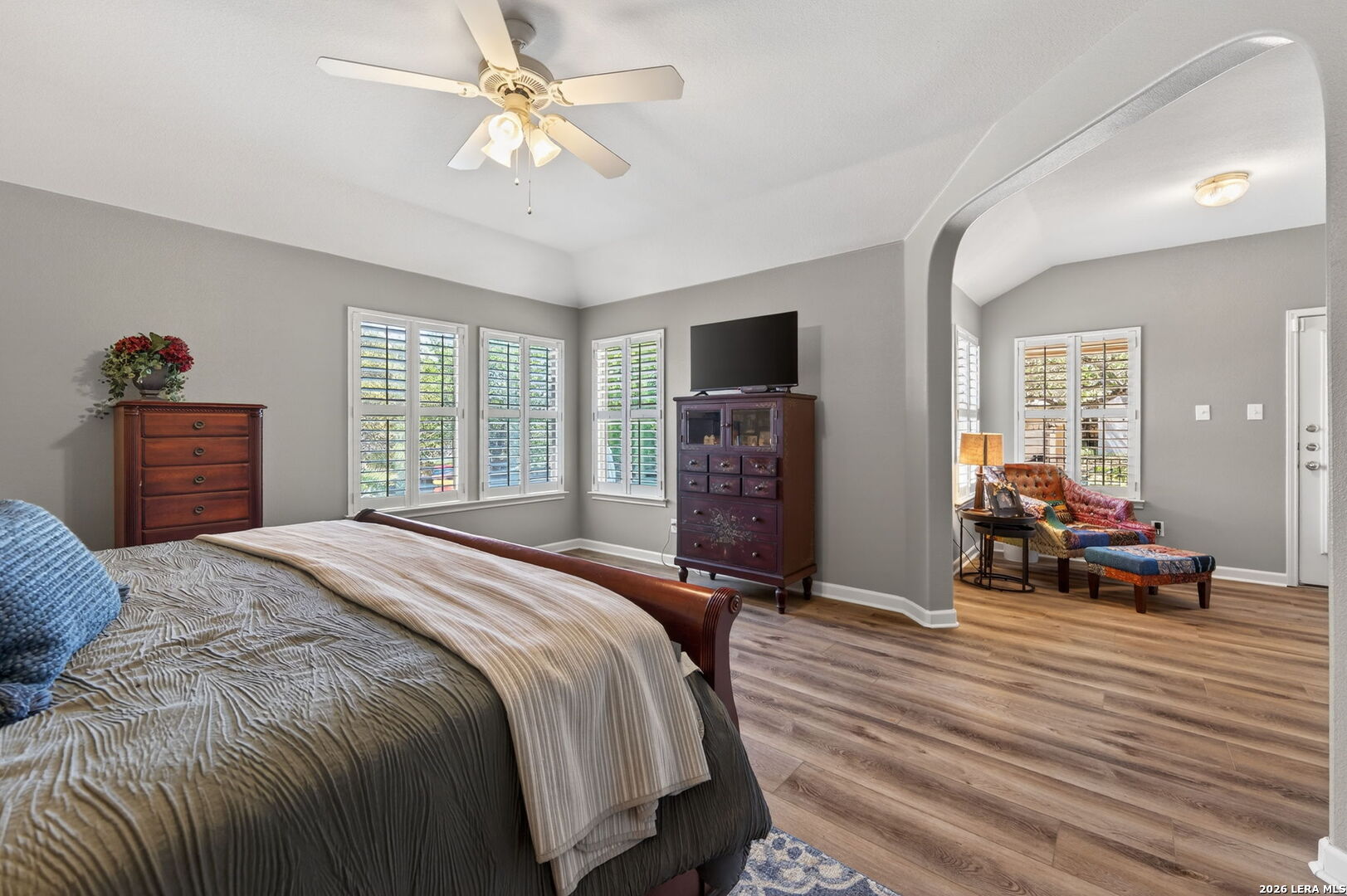 9514 Potters Point Helotes, TX 78023 - Photo 22 of 37 a bedroom with a bed and a chandelier