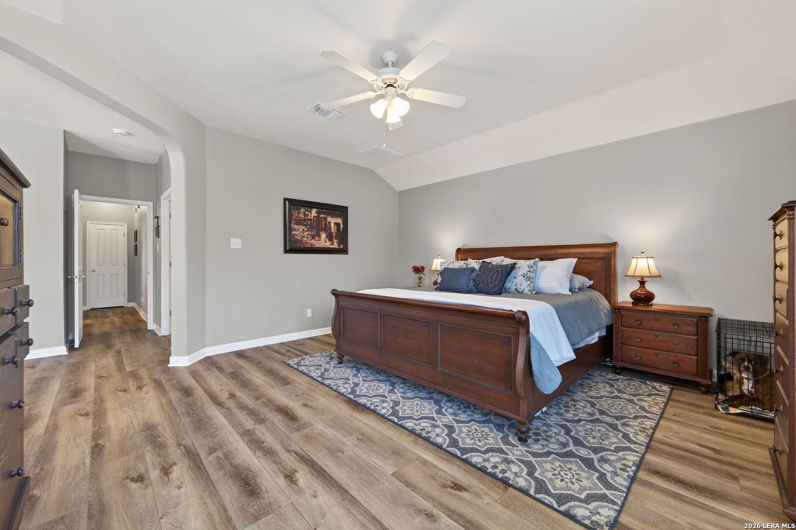 9514 Potters Point Helotes, TX 78023 - Photo 23 of 37 a bedroom with bed and a chandelier