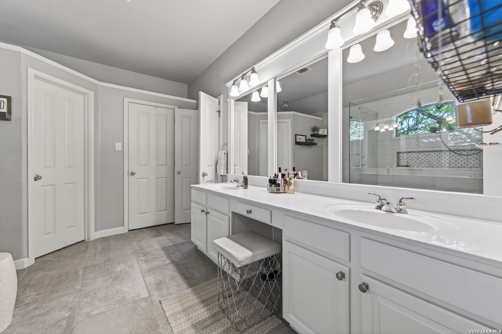 9514 Potters Point Helotes, TX 78023 - Photo 26 of 37 a spacious bathroom with a double vanity sink mirror and