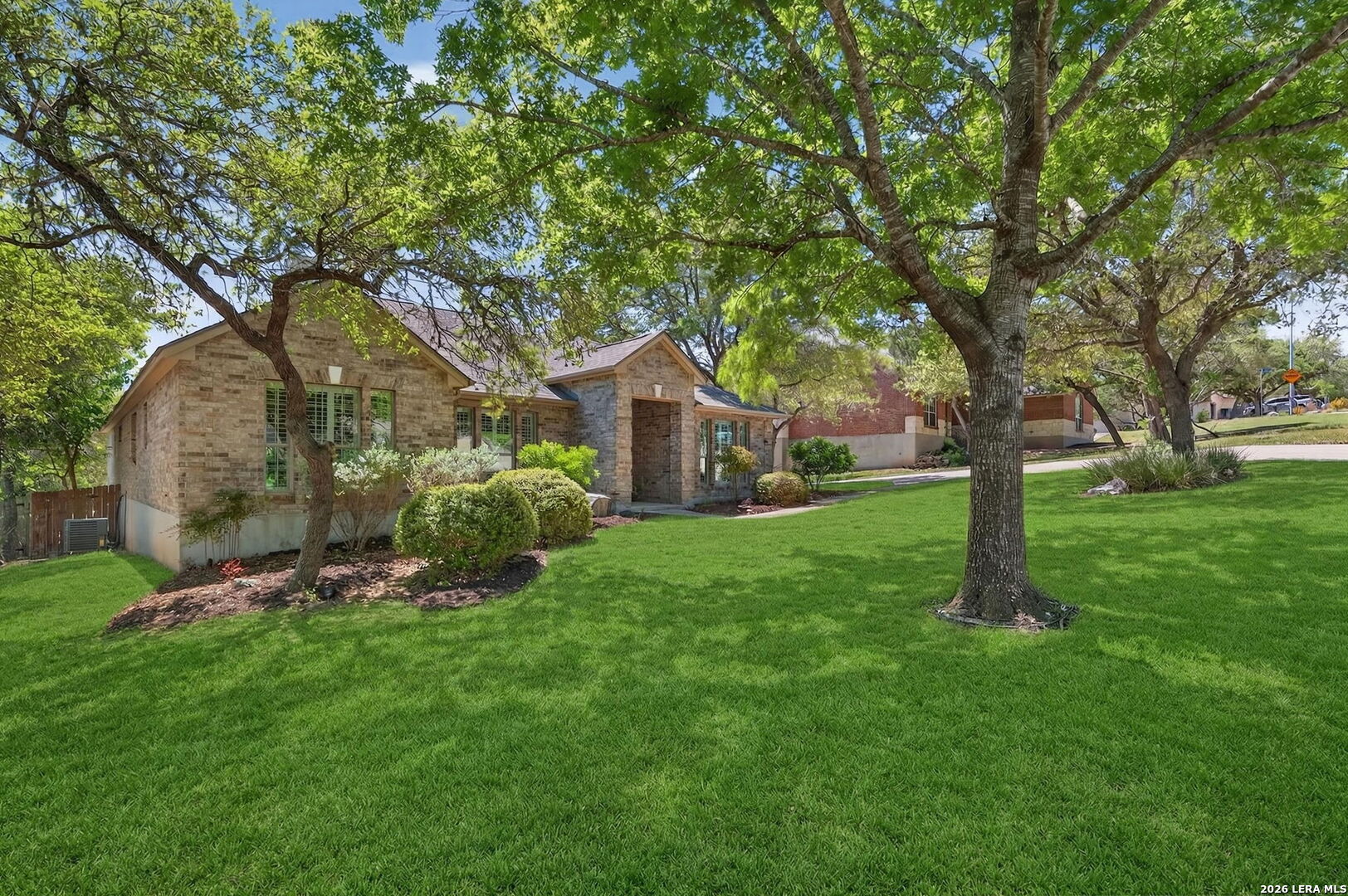 9514 Potters Point Helotes, TX 78023 - Photo 3 of 37 a backyard of a house with lots of green space