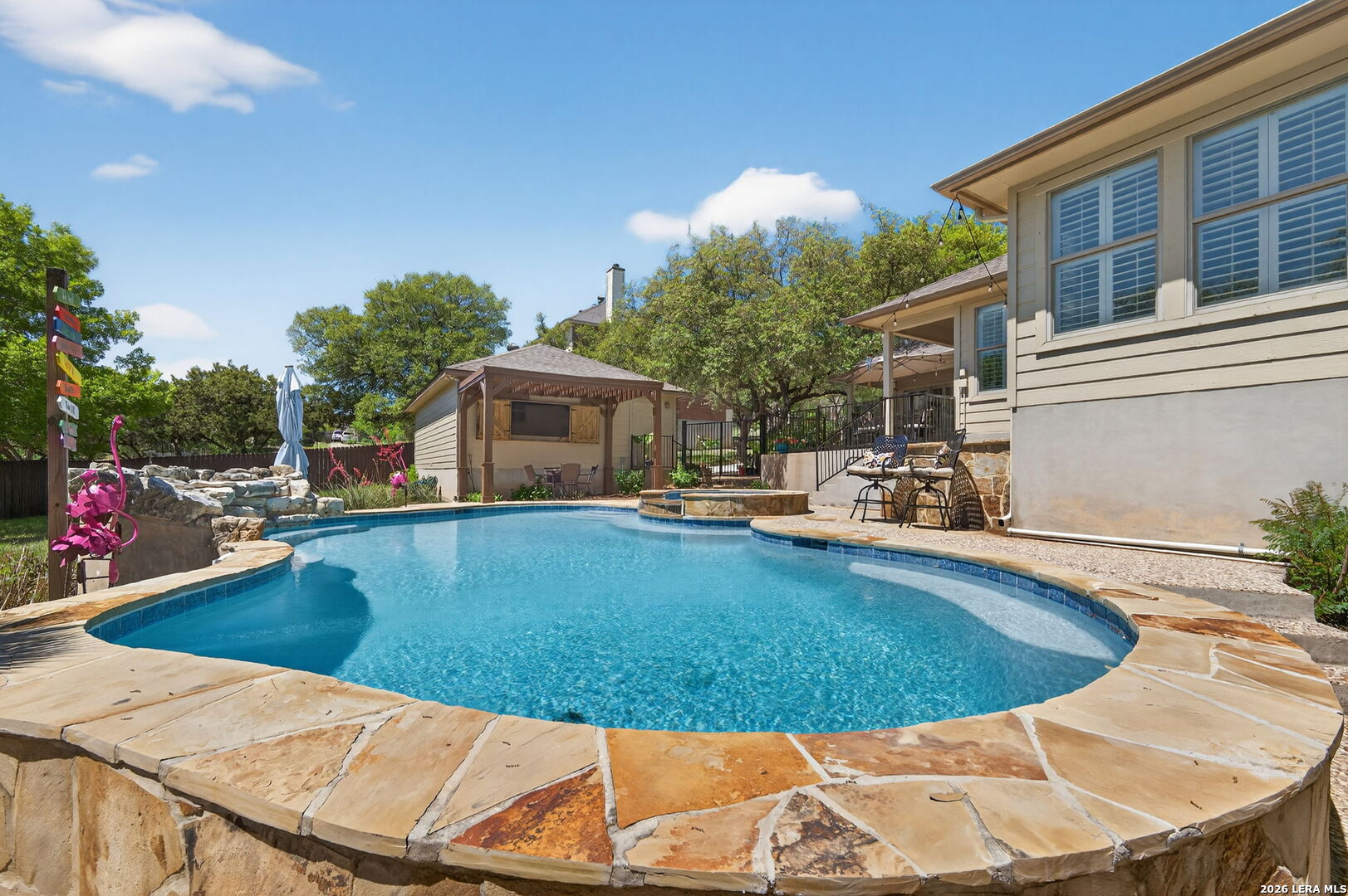 9514 Potters Point Helotes, TX 78023 - Photo 31 of 37 a view of a swimming pool with a patio