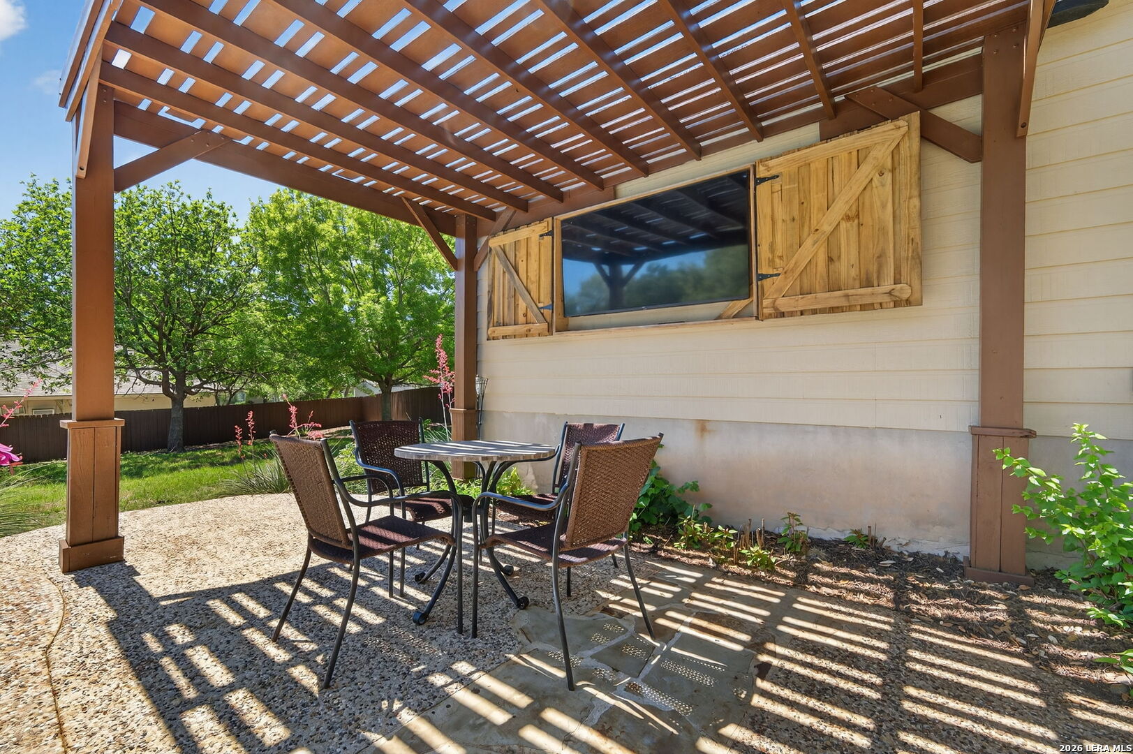 9514 Potters Point Helotes, TX 78023 - Photo 33 of 37 a view of patio with table and chairs and potted plants
