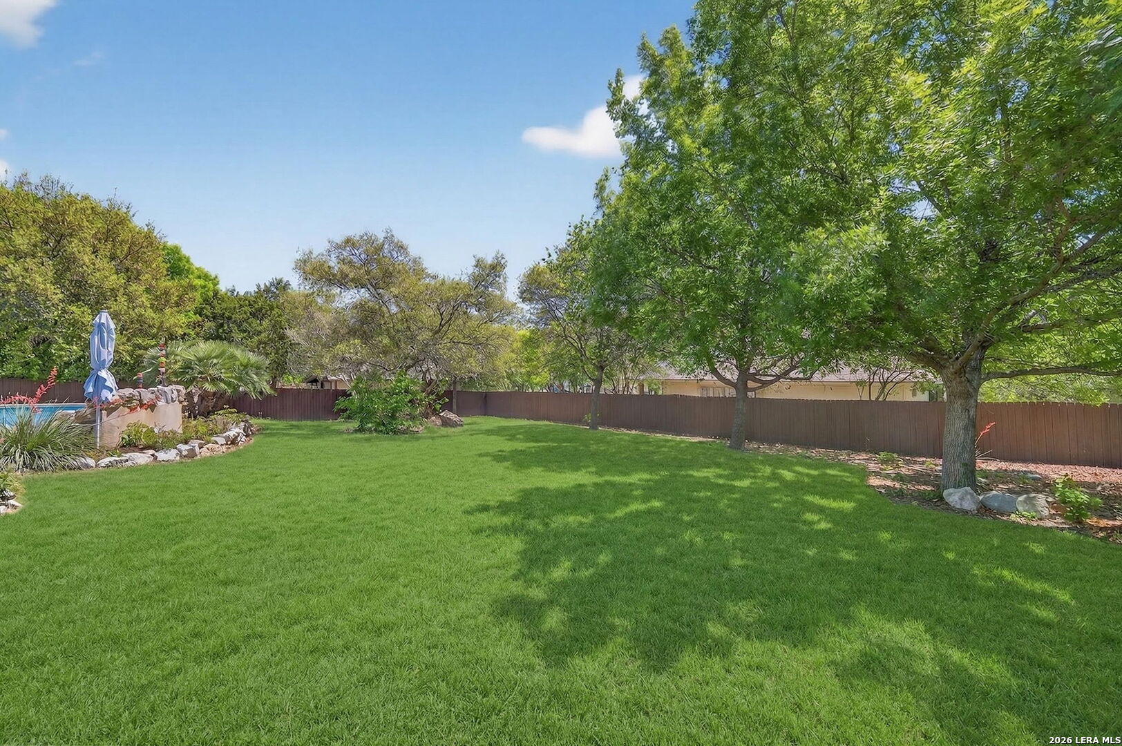 9514 Potters Point Helotes, TX 78023 - Photo 36 of 37 a view of green field with trees in the background