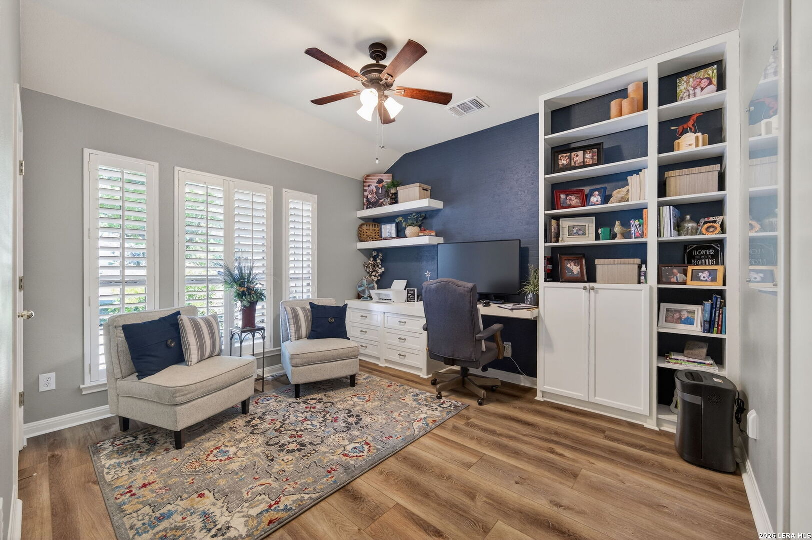 9514 Potters Point Helotes, TX 78023 - Photo 8 of 37 a living room with furniture and a book shelf