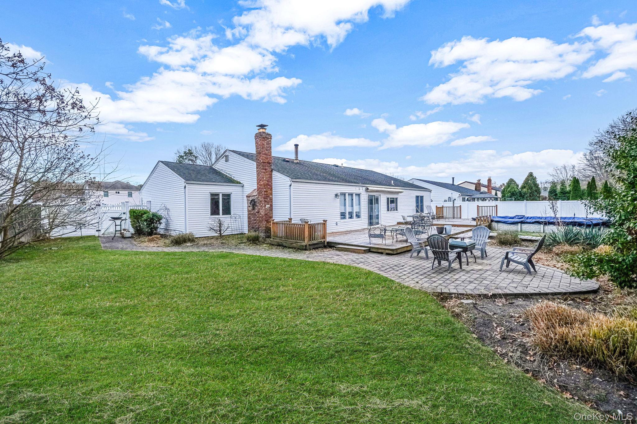 32 San Rafael Avenue Holbrook, NY 11741 - Photo 14 of 44 a view of house with backyard and outdoor seating