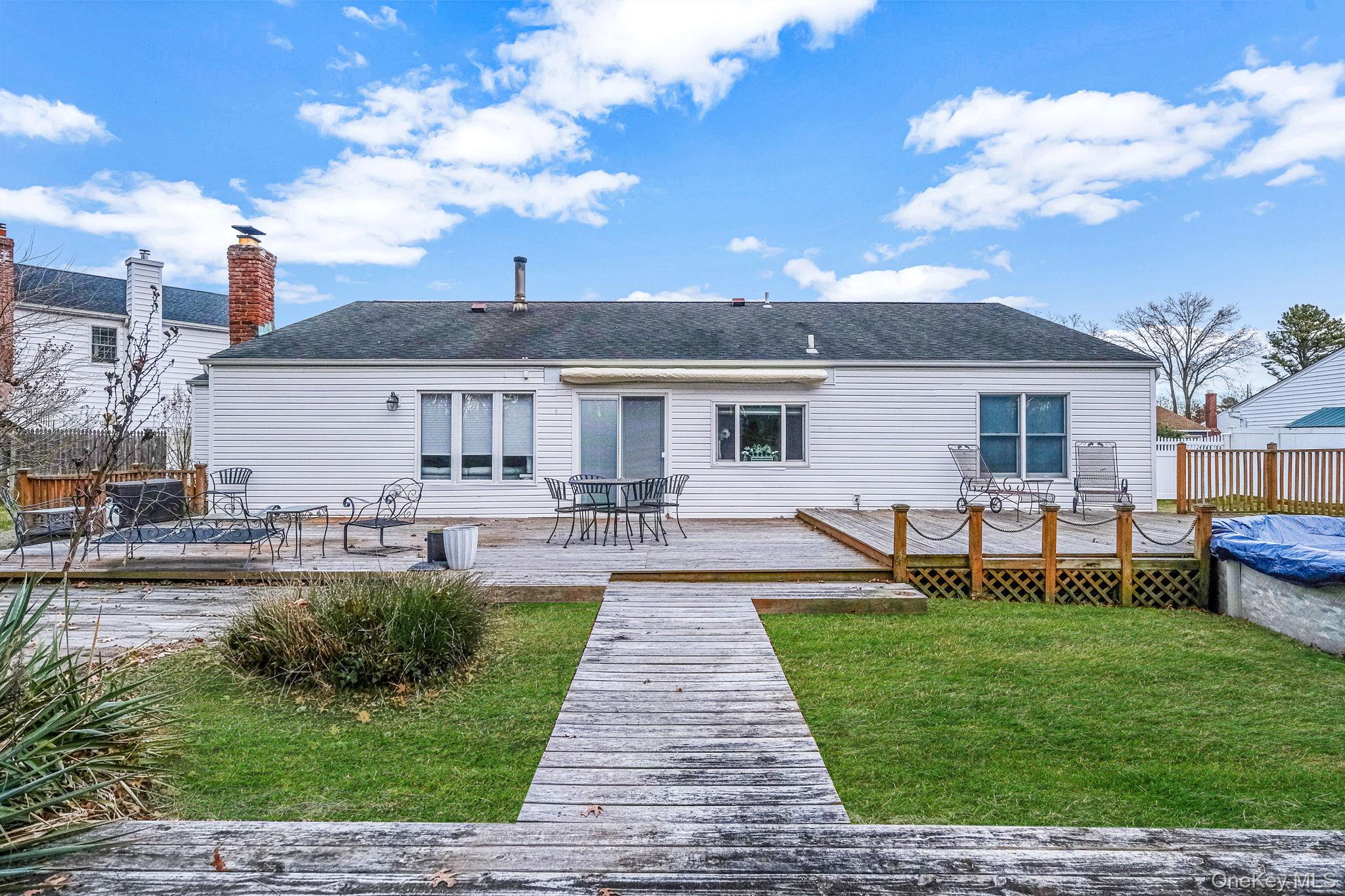 32 San Rafael Avenue Holbrook, NY 11741 - Photo 17 of 44 a front view of a house with a yard