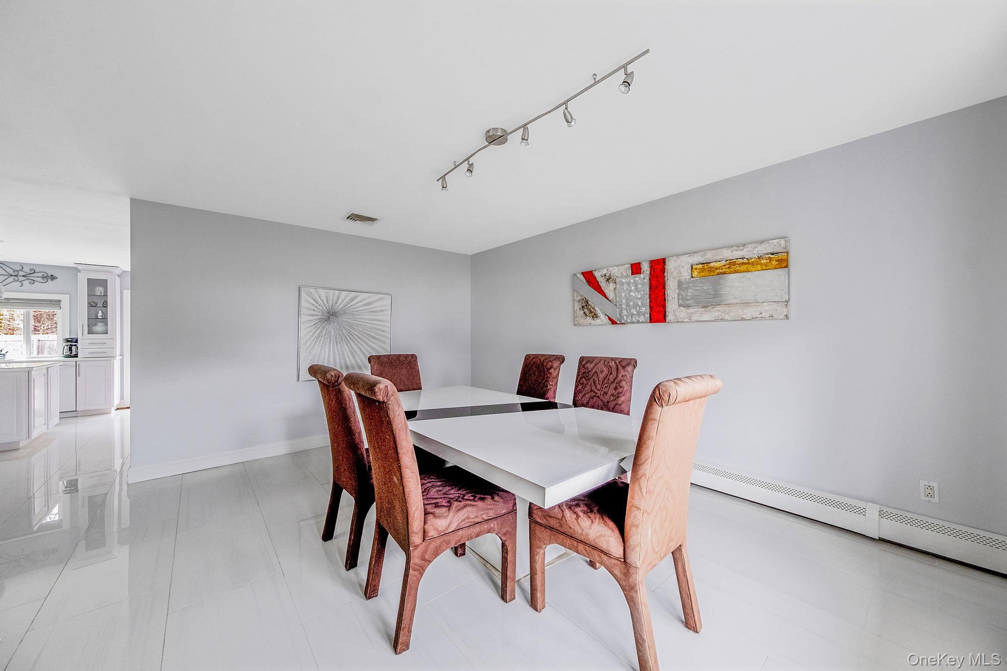 32 San Rafael Avenue Holbrook, NY 11741 - Photo 21 of 44 a view of a dining room with furniture