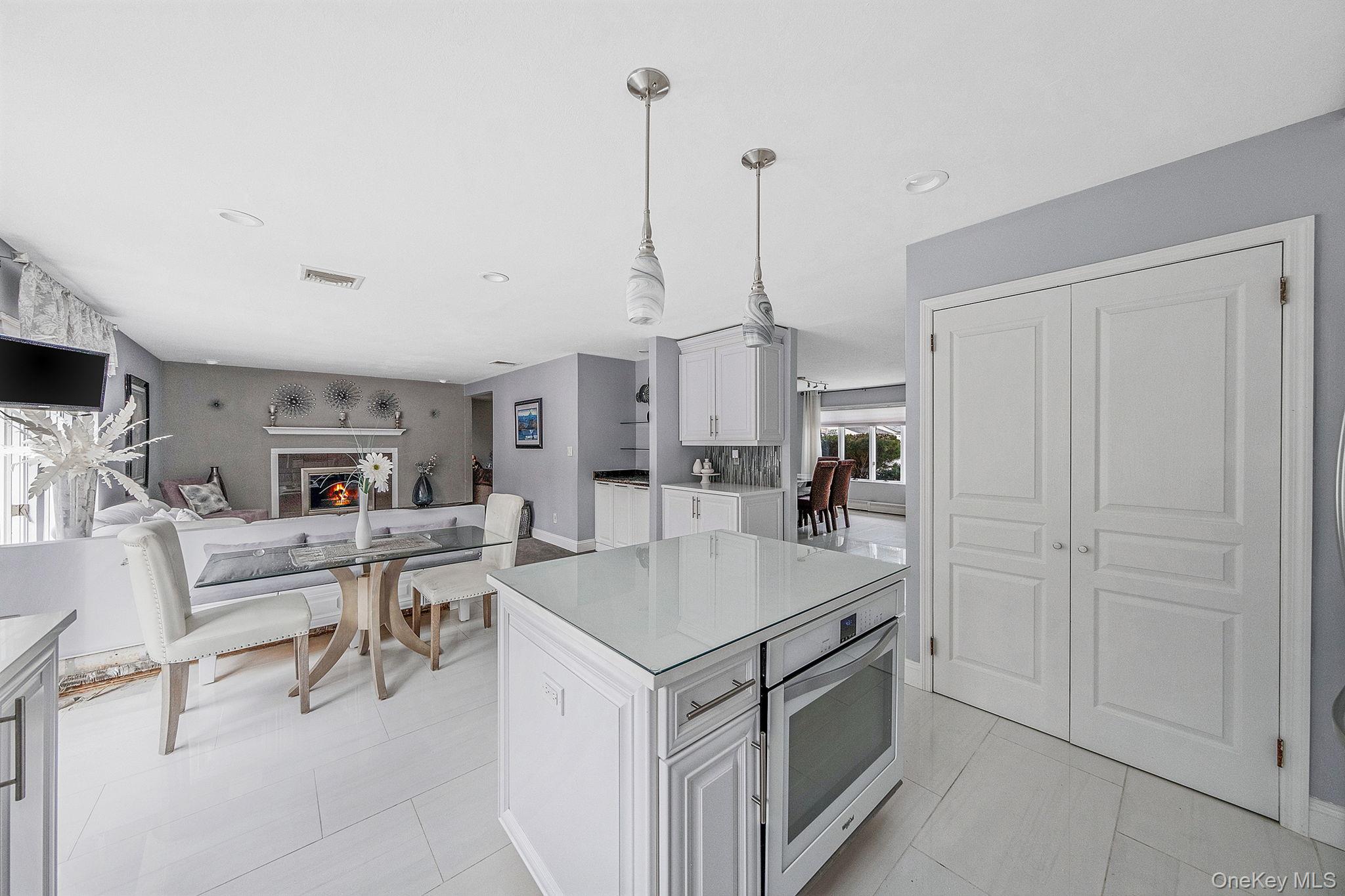 32 San Rafael Avenue Holbrook, NY 11741 - Photo 43 of 44 a view of living room kitchen with furniture and wooden floor