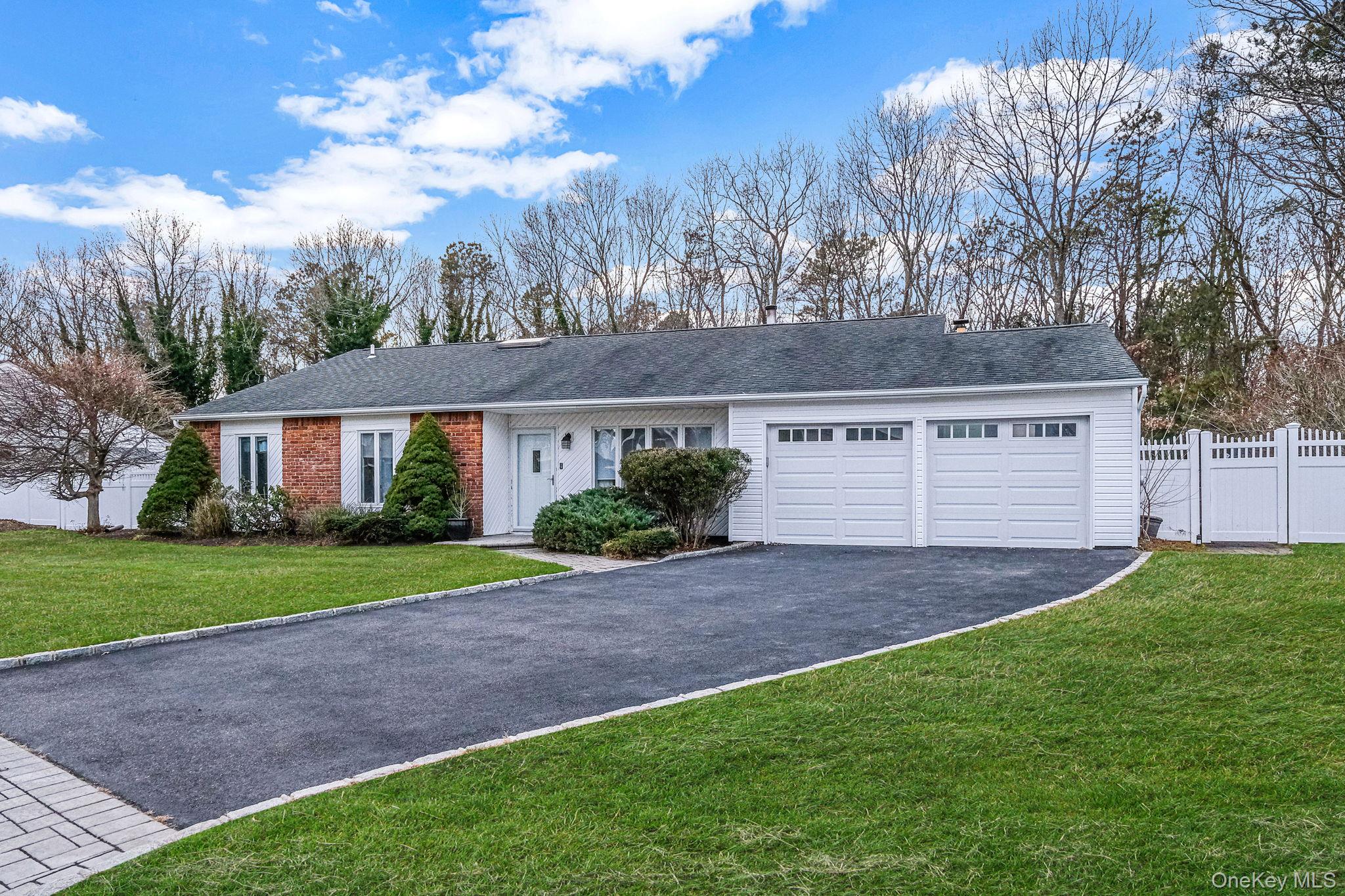 32 San Rafael Avenue Holbrook, NY 11741 - Photo 3 of 44 a view of a yard with a house and a large tree