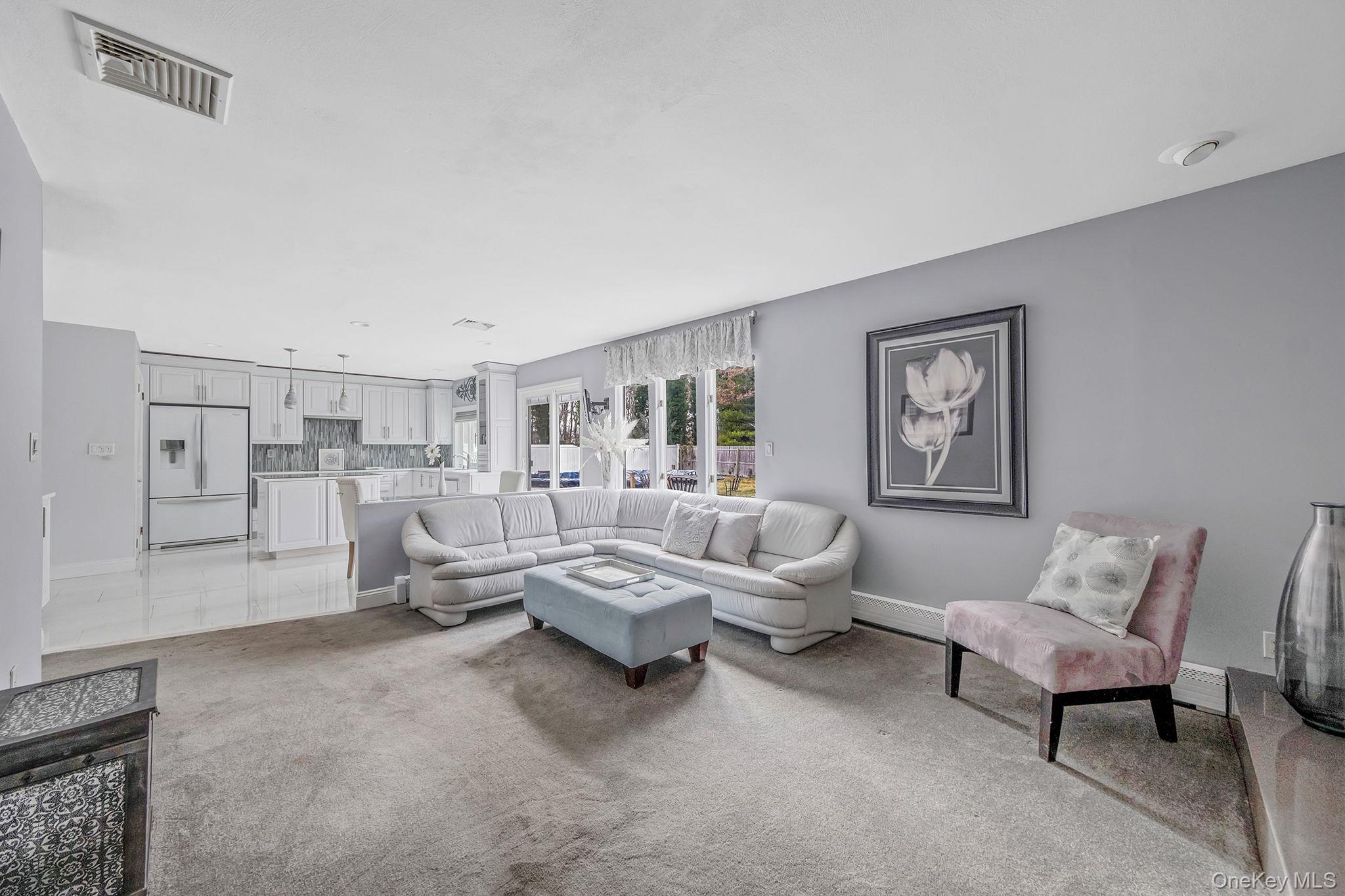 32 San Rafael Avenue Holbrook, NY 11741 - Photo 28 of 44 a living room with furniture and a couch