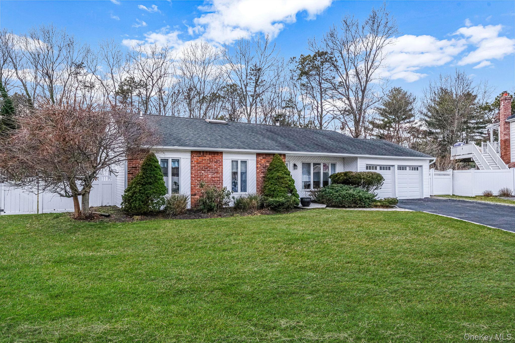 32 San Rafael Avenue Holbrook, NY 11741 - Photo 4 of 44 a front view of a house with garden