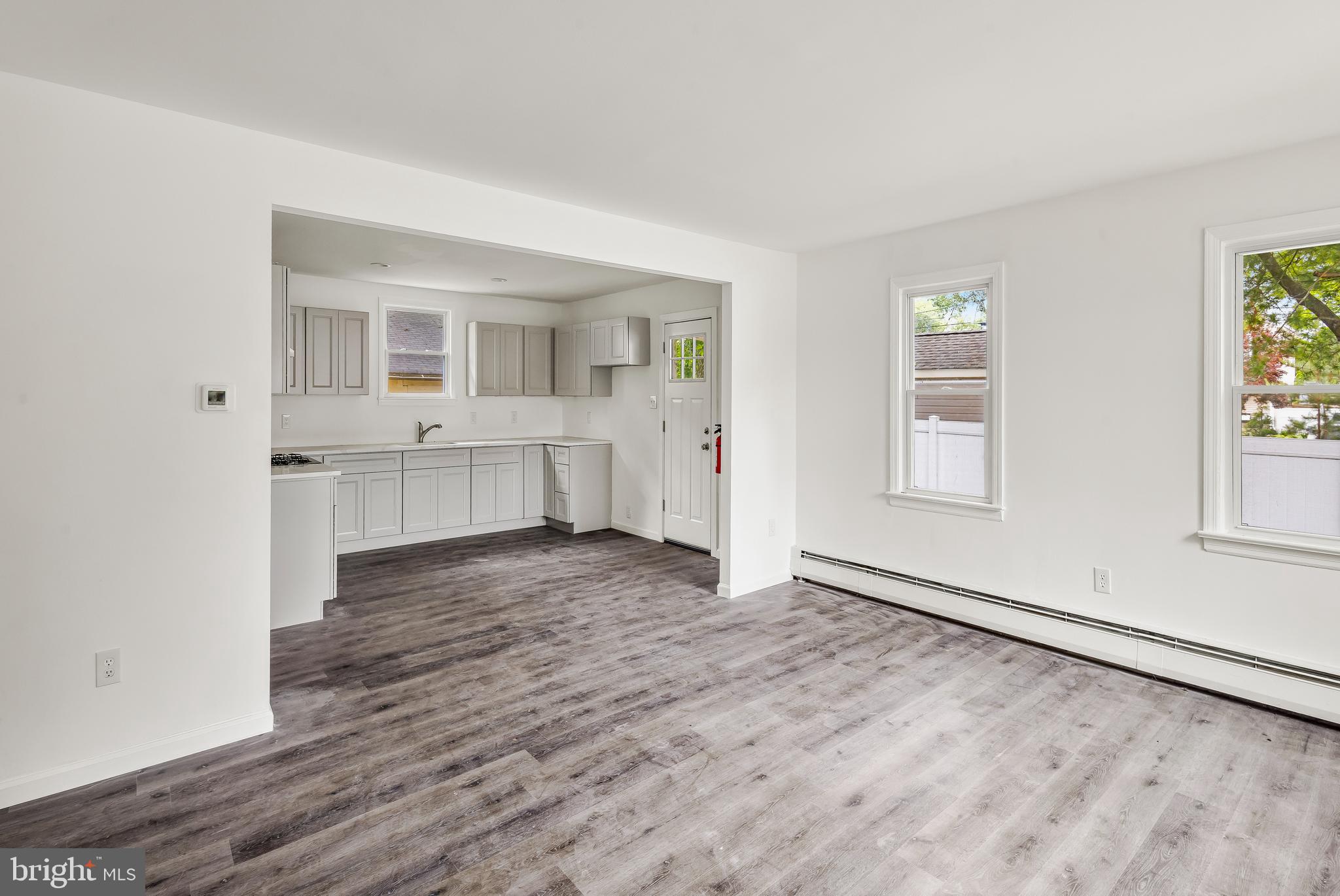 505 West Evesham Road, Unit A Glendora, NJ 08029 - Photo 3 of 11 an empty room with windows and entrance